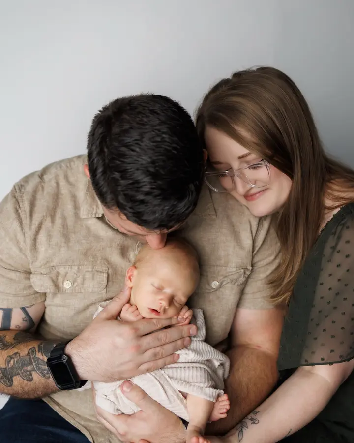 Courtney and Isiah Huff holding their newborn son Jameson, Arbor Fertility patients